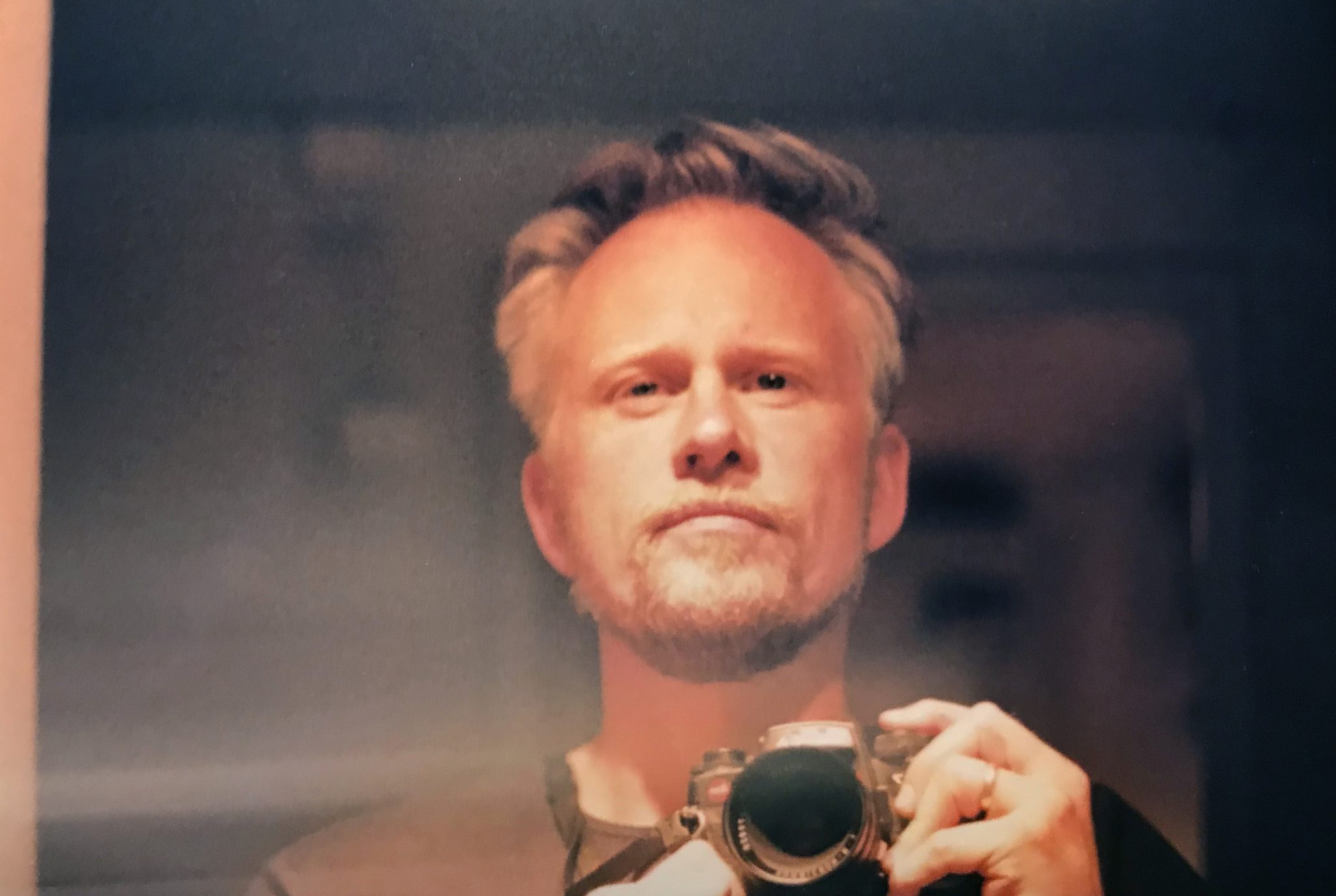 Self portrait of a man with a camera.